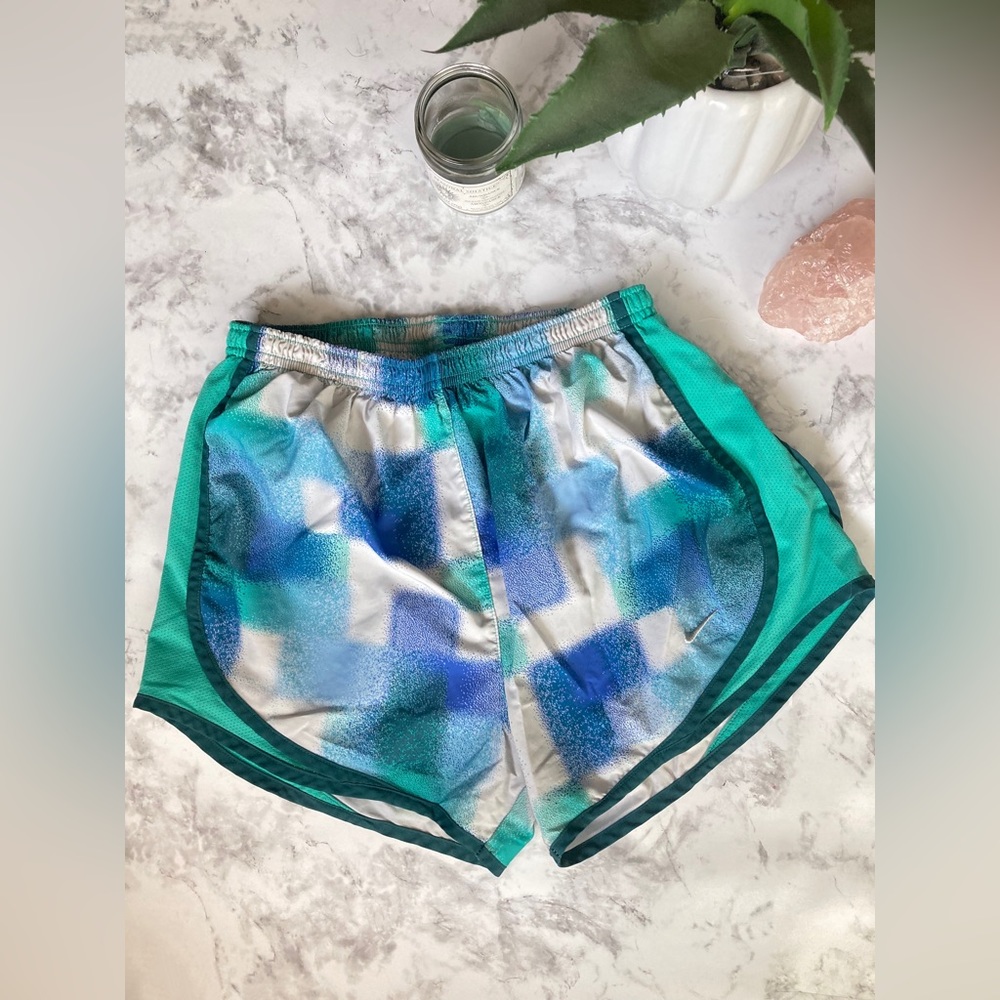 Blue and green Nike running shorts